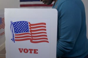 MS side view african american man in blue sweater and face hidden