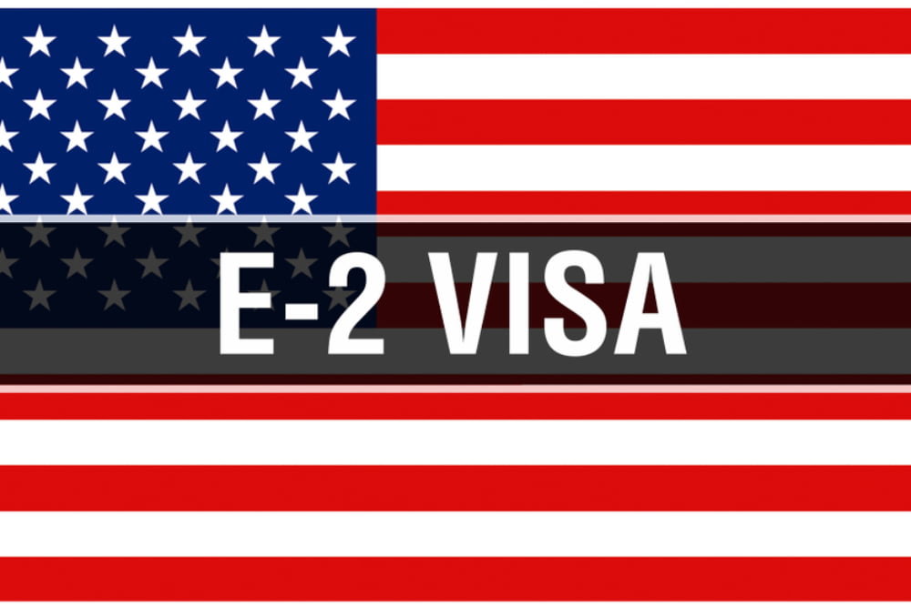 E-2 Visa on a USA flag background
