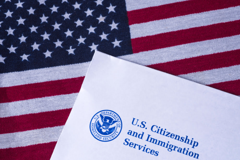 Letter from US Citizenship and Immigration Services on Flag of United States of America